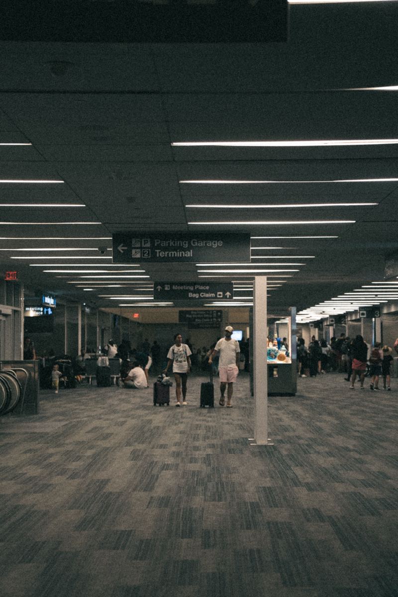Travelers walking through the RDU airport terminal