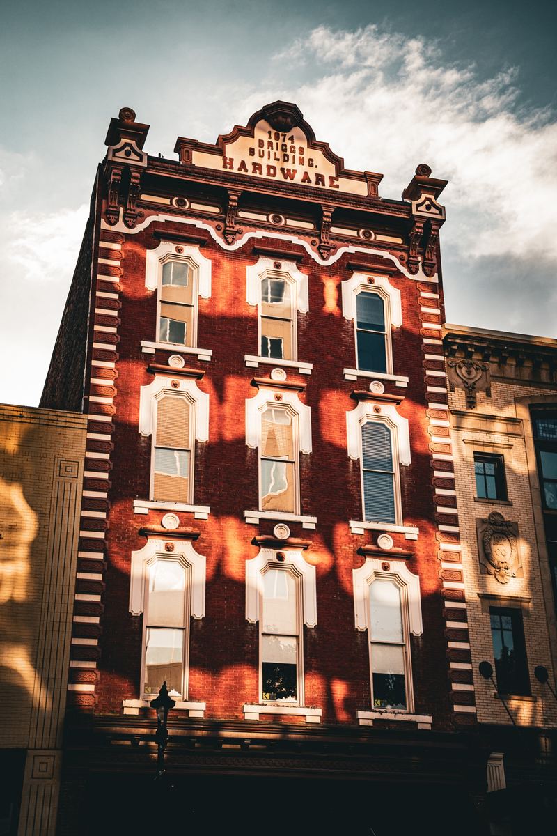 Historic red-brick hardware building in downtown Raleigh in warm afternoon light
