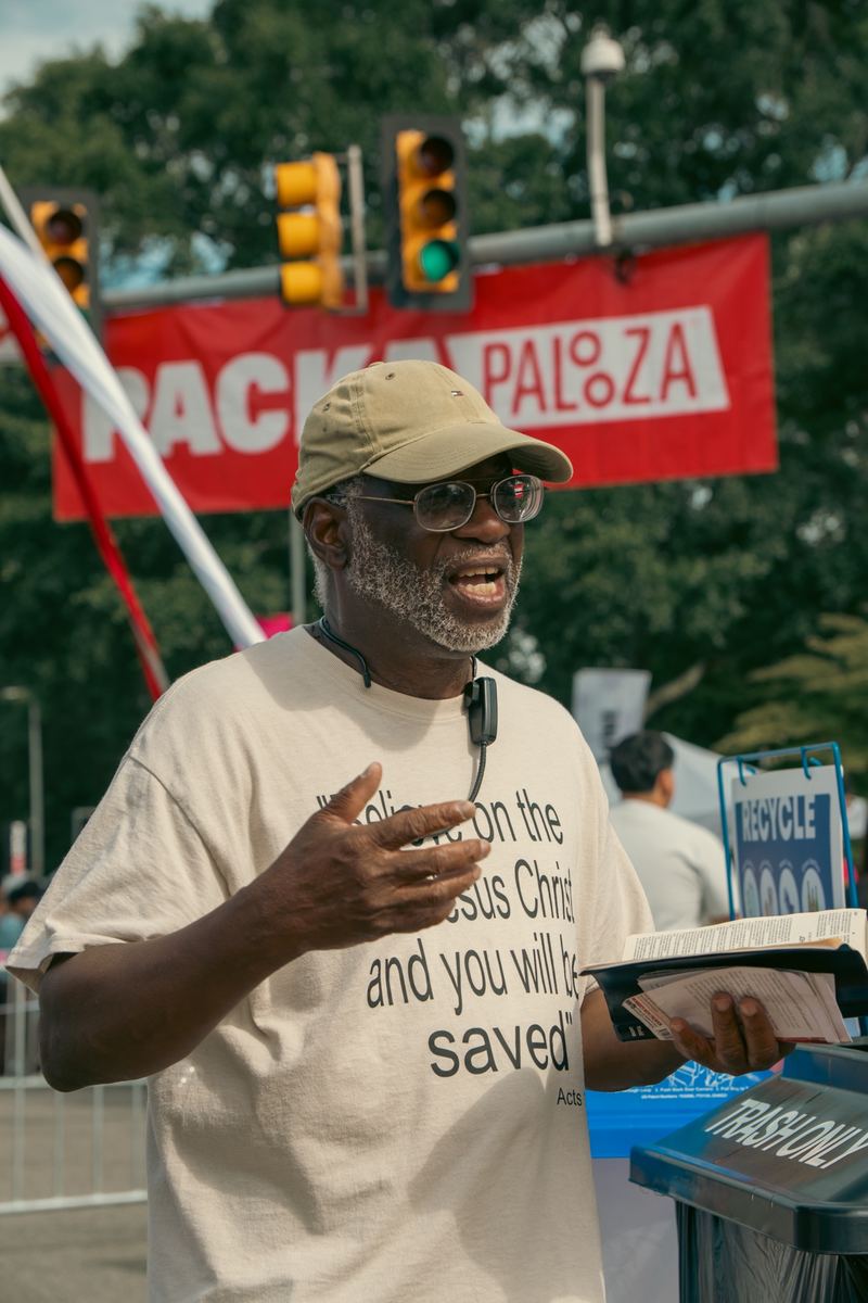Smiling street preacher at NC State's Packapalooza street festival in Raleigh